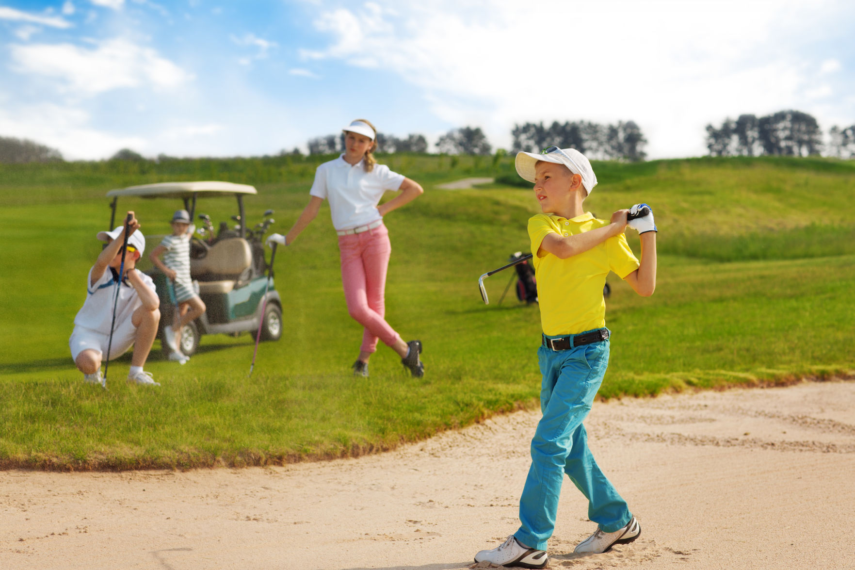 Kids playing golf